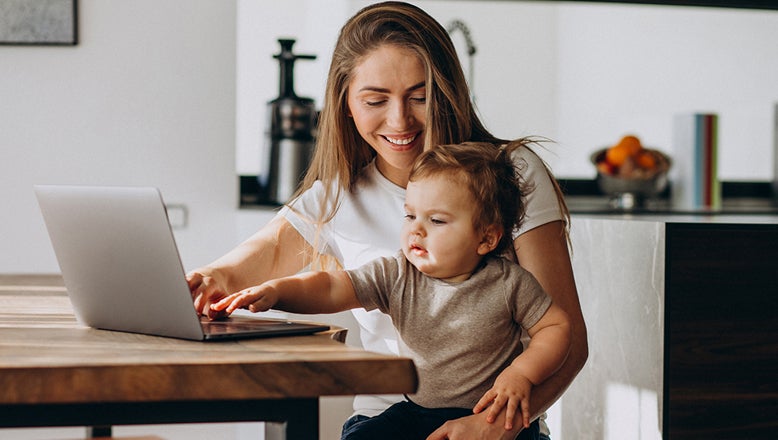 woman working at home with child
